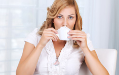 905_BizConfidence246x155 Business woman drinking coffee