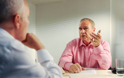 Two business directors consider leasing cars for their business