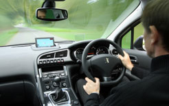 Interior of Peugeot 3008 with driver at the wheel