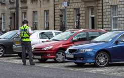 Parking warden issuing a parking ticket