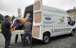 Lion sculptures being loaded into a long wheelbase Ford Transit in Bath