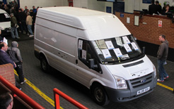 Smith Edison electric van going through the auction hall at BCA Blackbushe. The electric van realised &pound;10,100.