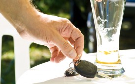Man putting down beer and picking up car keys