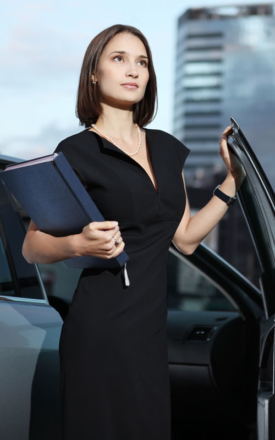 Businesswoman with company car on a business car lease
