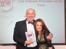 Nigel Trotman receives the award from comedian Lucy Porter