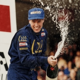 Colin McRae celebrates winning the WRC title in 1995