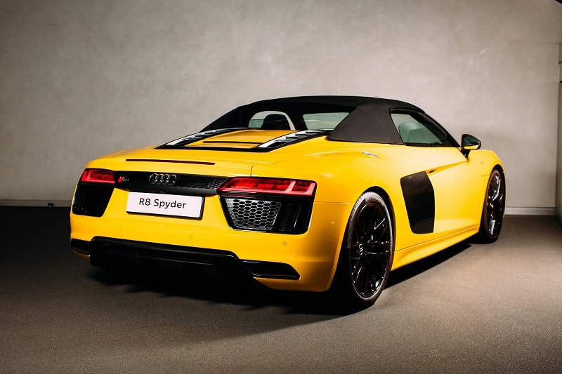 Sleek rear profile of the new Audi R8 Spyder with soft top roof up