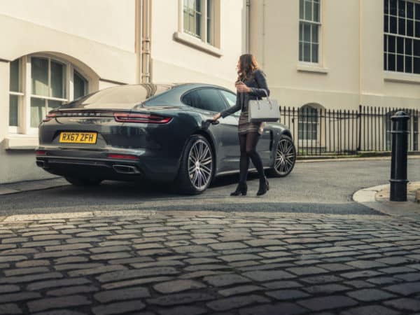 Porsche on demand Panamera with businesswoman