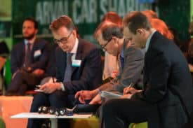 editor Ralph Morton (centre) takes notes at Arval conference